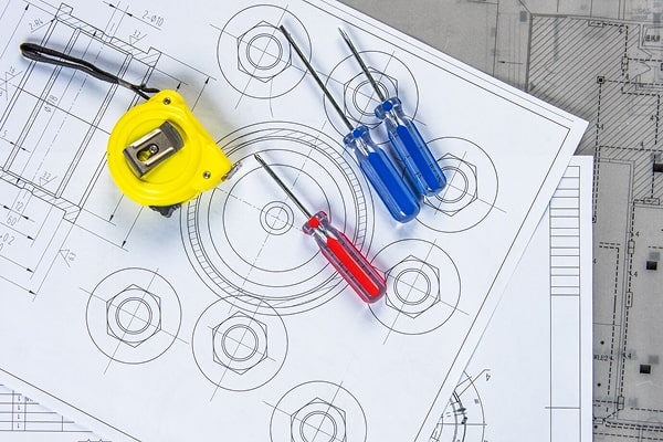 Electrical design permit drawings with engineering tools representing Ontario Electrical Safety Code compliant projects