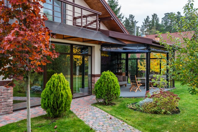 Modern garden suite detached accessory dwelling unit with glass windows and landscaped surroundings