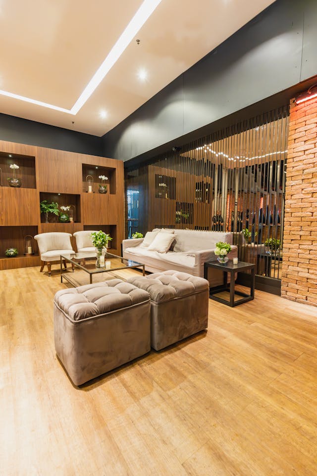 Modern finished basement living room with stylish furniture and warm lighting